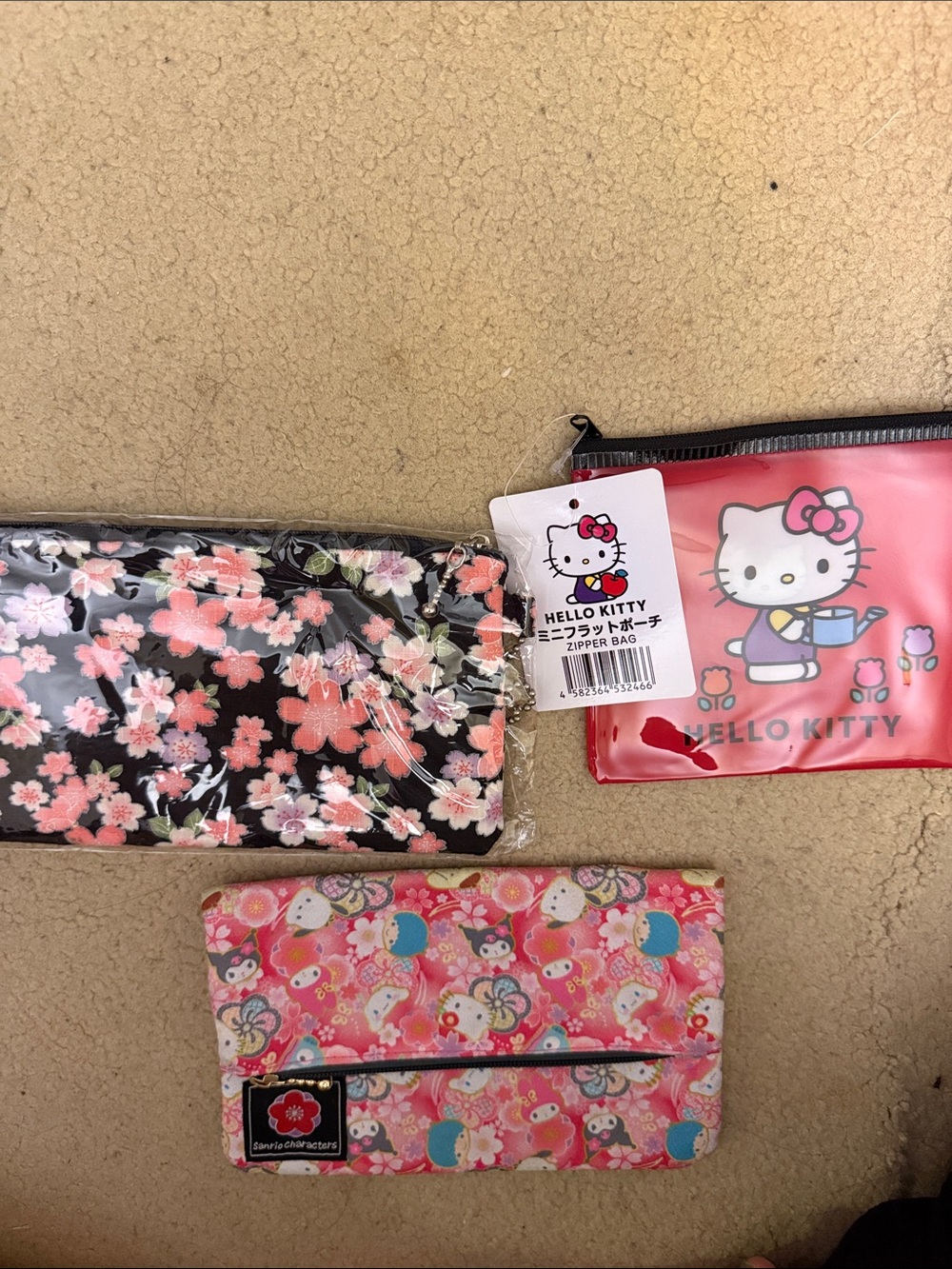 2 Hello Kitty pouch & 1 sealed floral pouch
